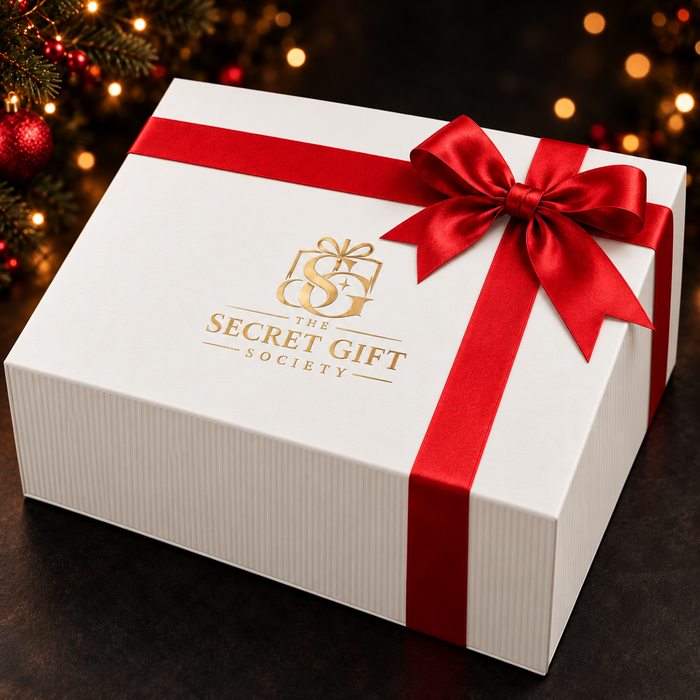 White Secret Gift Society gift box with red satin ribbon and gold logo
