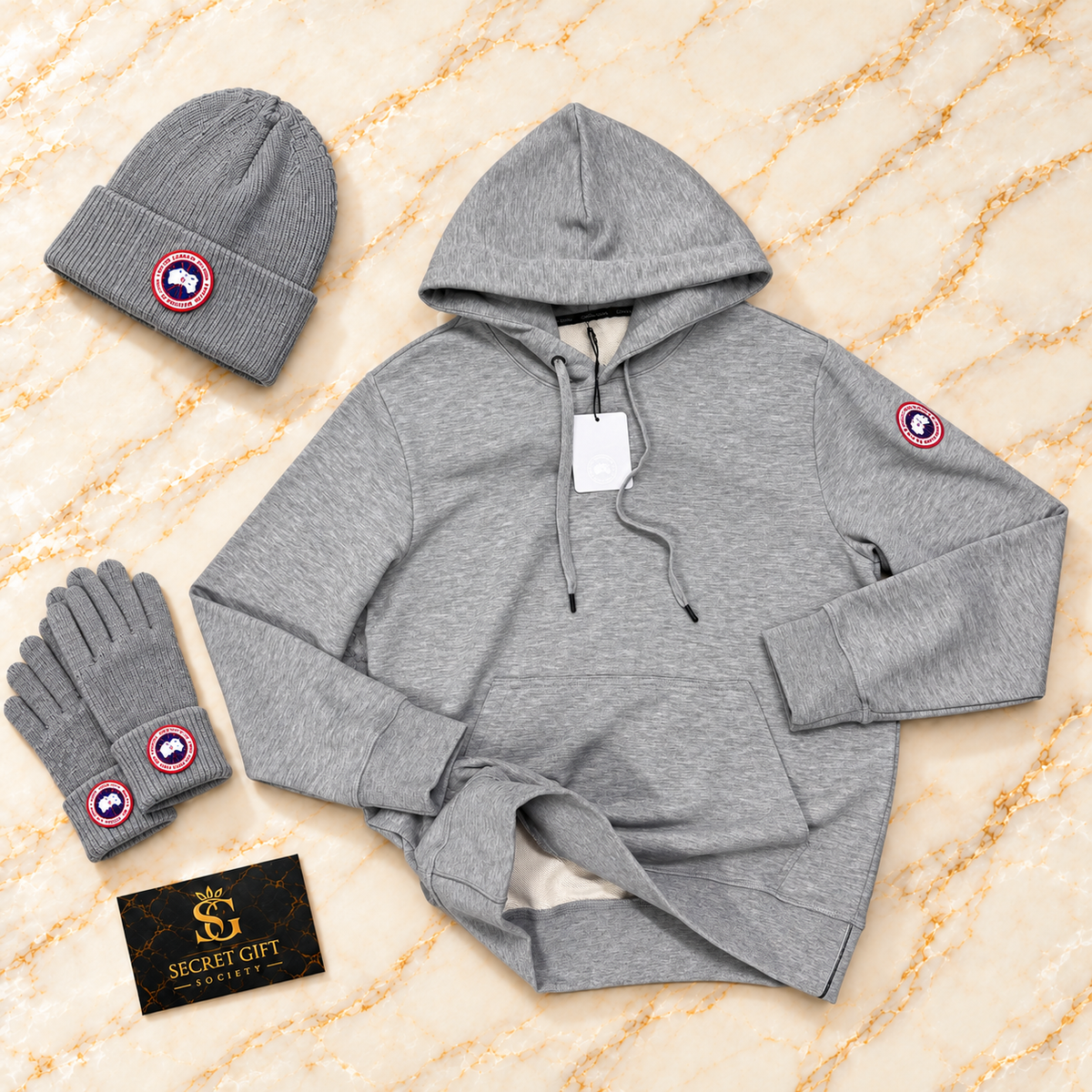 CG LOGO HOODIE - GREY with matching branded styling props and Secret Gift Society card