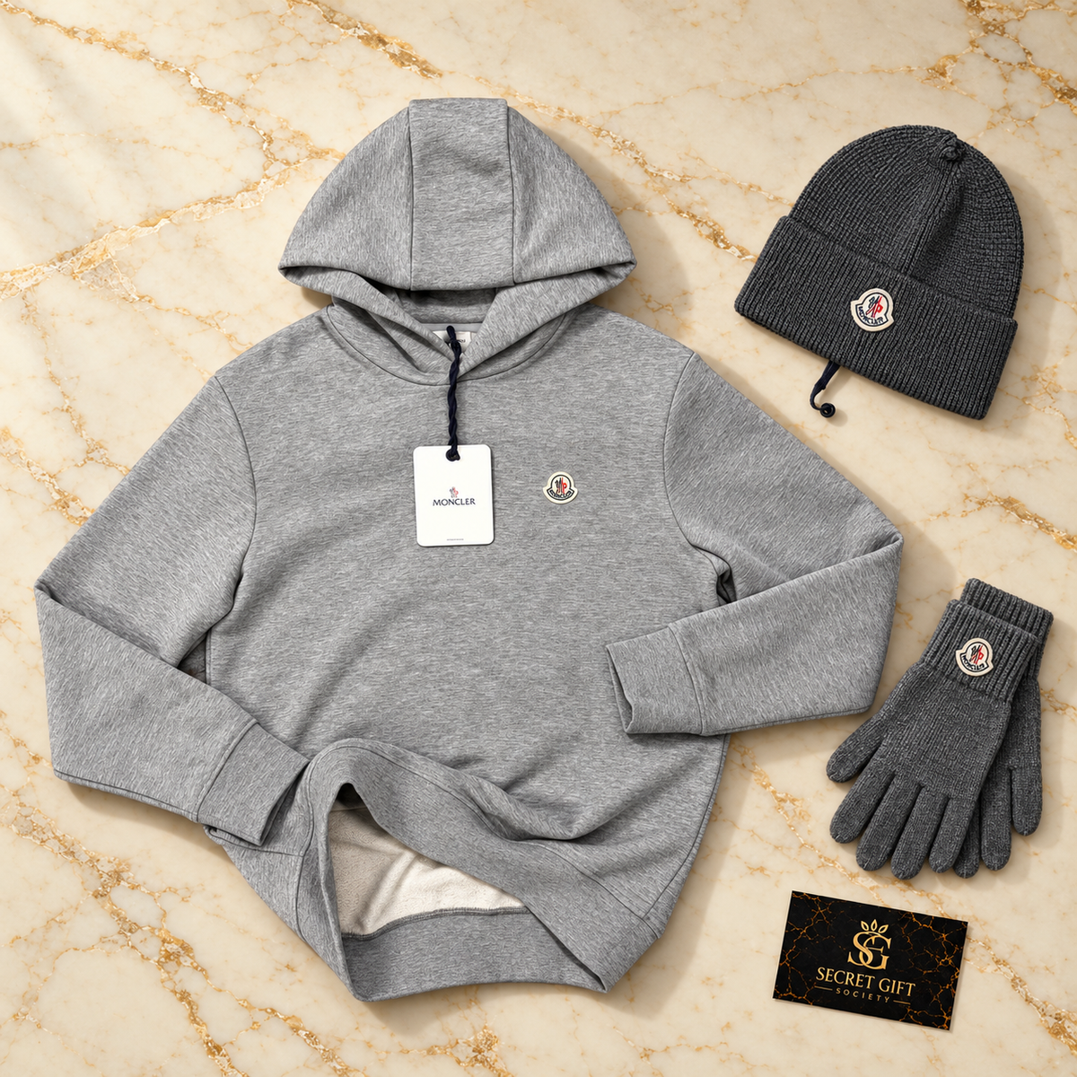 MNCLR LOGO HOODIE — Grey. Styling props not included.