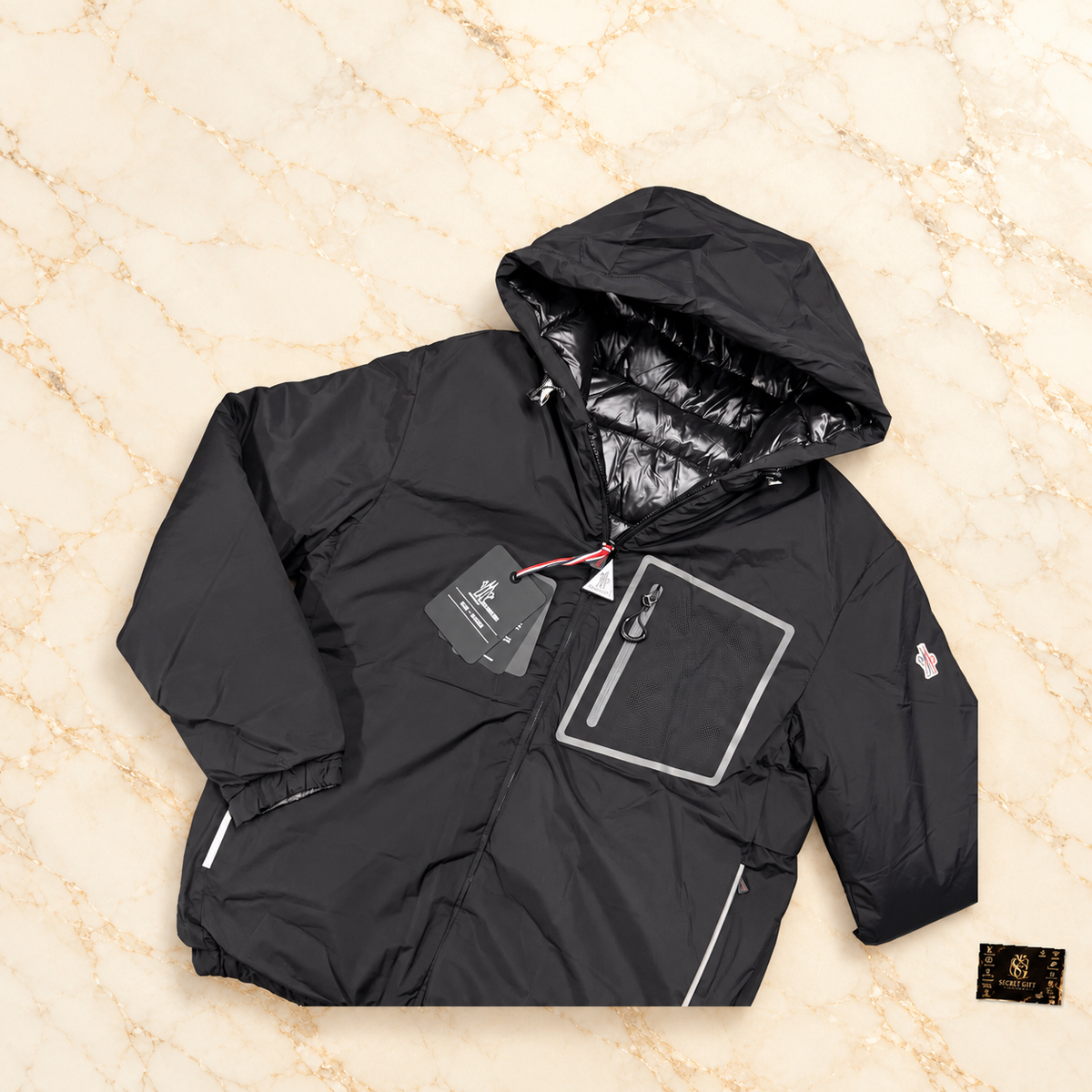 MNCLR BERGUN REVERSIBLE COAT - BLACK on ivory marble with Secret Gift Society card