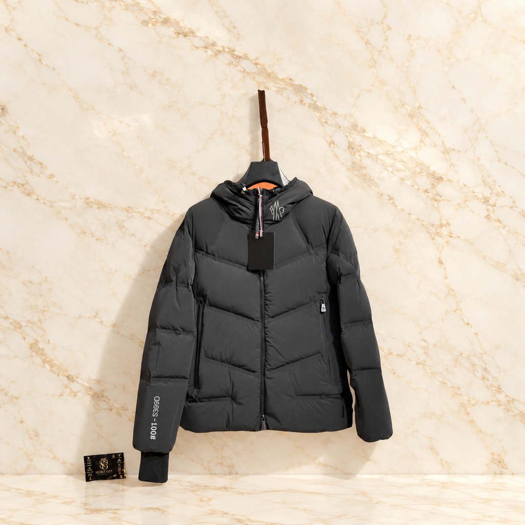 MNCLR REFLECTIVE GRENOBLE COAT - BLACK on ivory marble with Secret Gift Society card