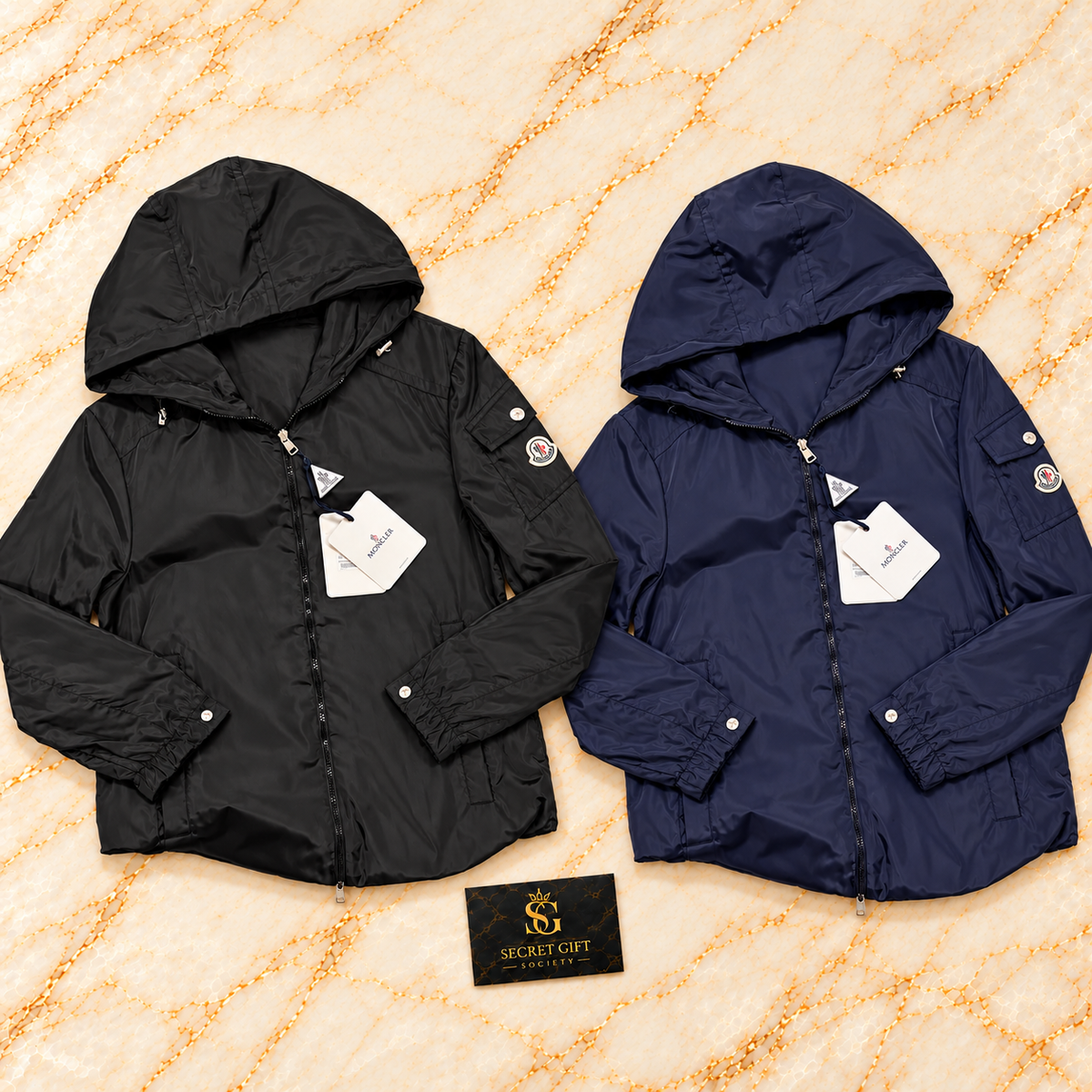 Moncler ETIACHE HOODED JACKET — Black, Navy colour collage. Choose a colour and size; one garment per order. Secret Gift Society card is a styling prop.