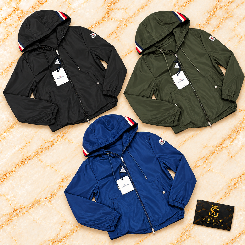 Moncler Grimpeurs jacket in Black, Khaki and Blue on ivory marble. Choose from four colours in the product options.
