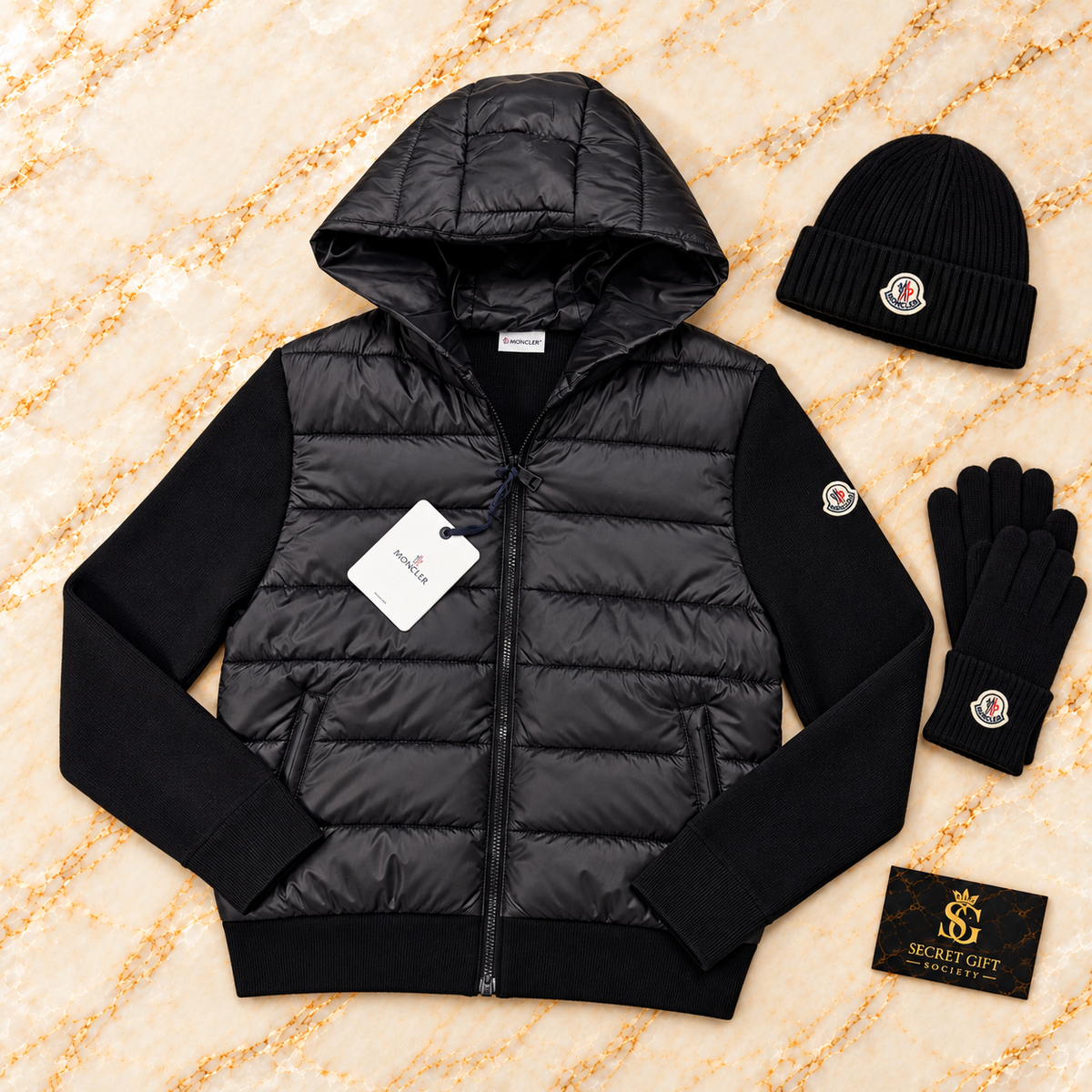 MNCLR PADDED JACKET — Black. Styling props not included.